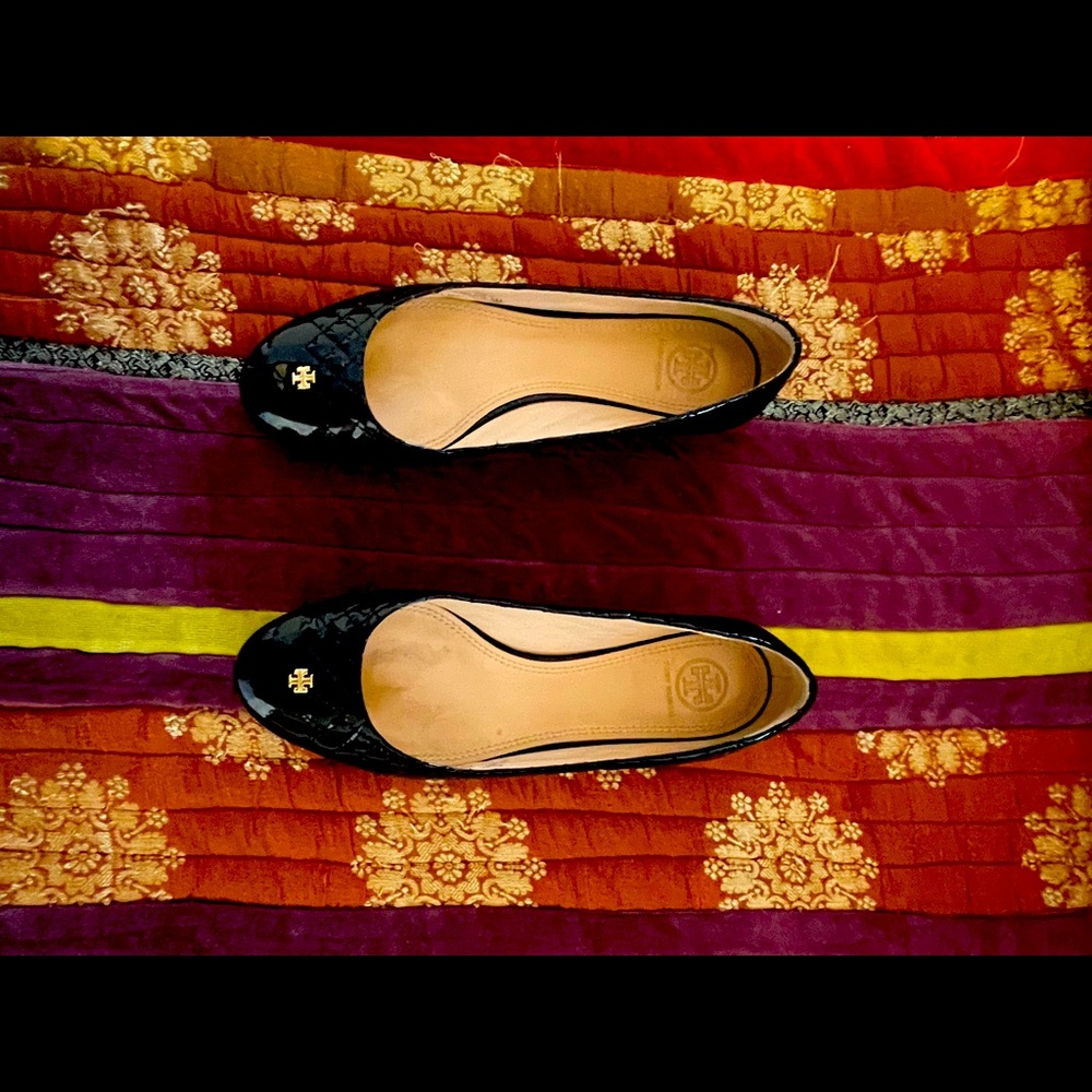 Black patent leather Tory Burch shoes.
